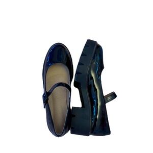 Black platformed Mary Janes.
